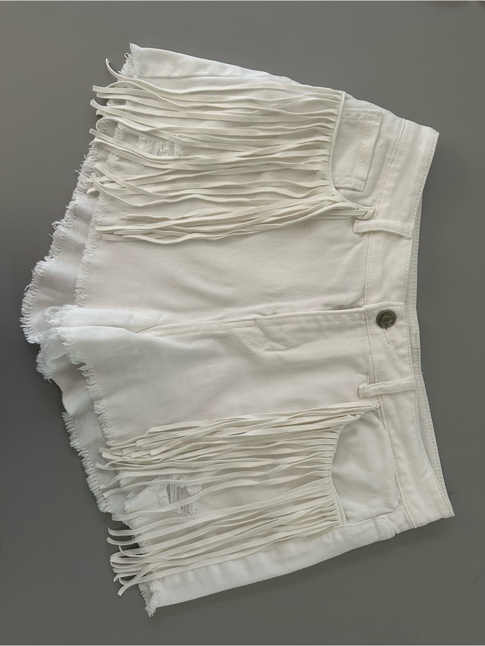 white fringe denim shorts